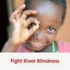 a girl smiling holding up a river blindness pill