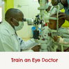 A doctor with a mask giving a little boy an eye examination with the title saying ' train an eye doctor'